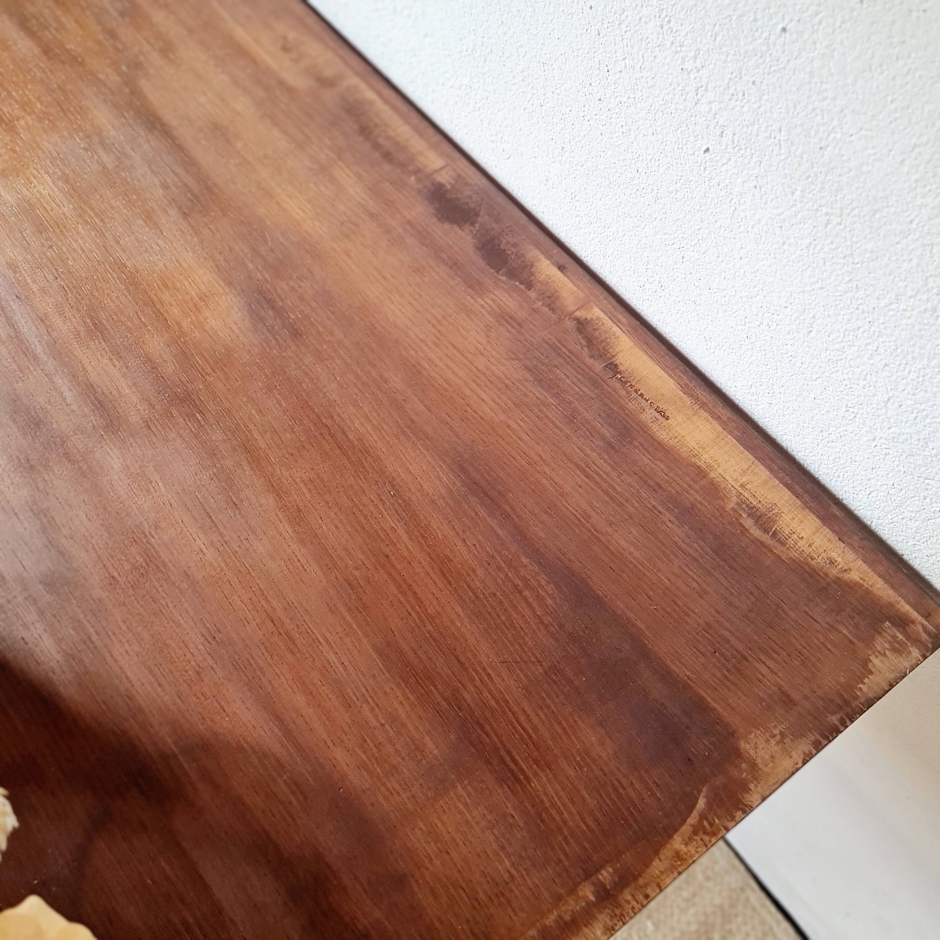 Metal tubular base table with a wooden top.