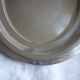 Oval plate in silver metal