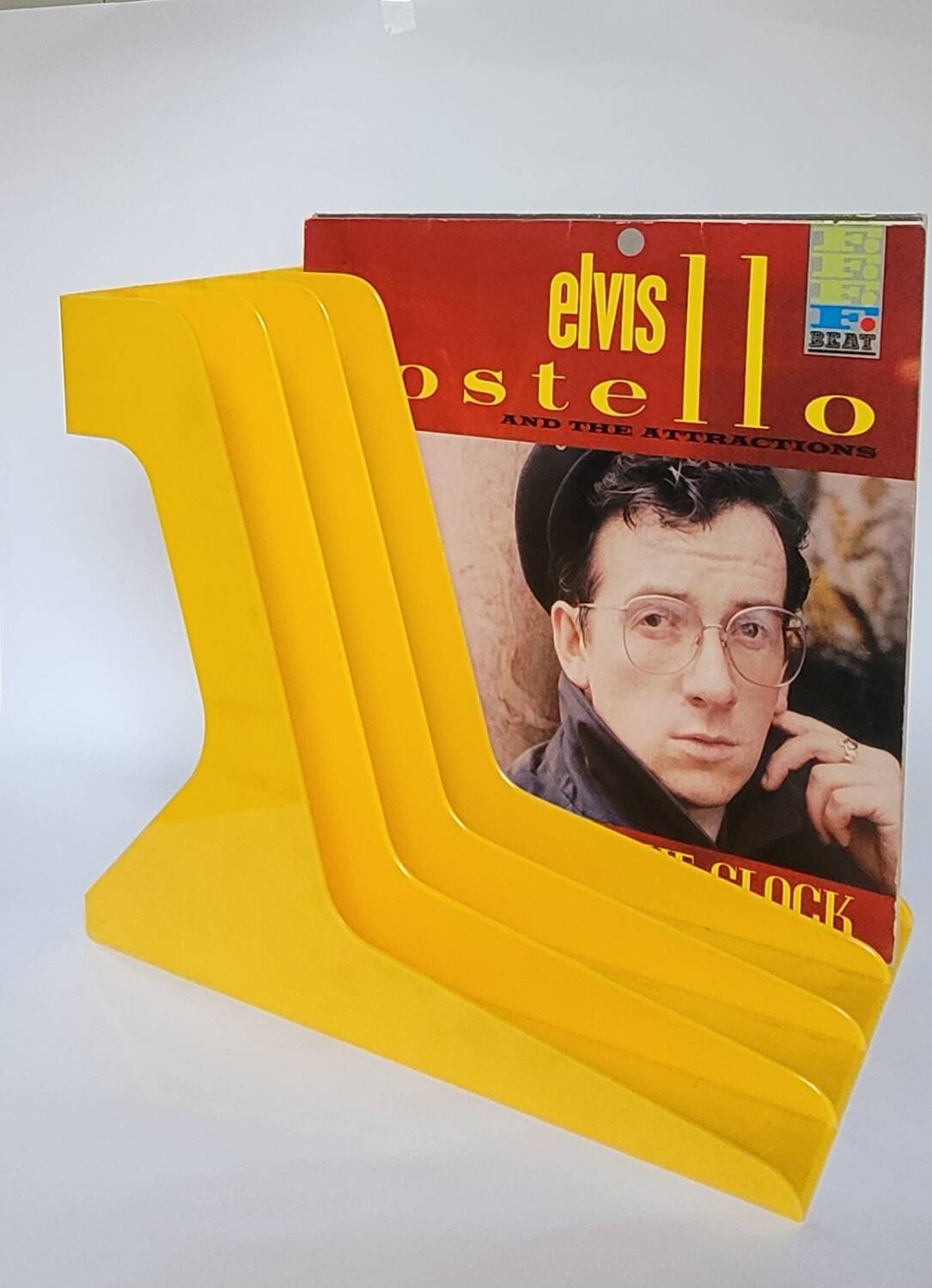Yellow plastic vinyl racks from the 70s