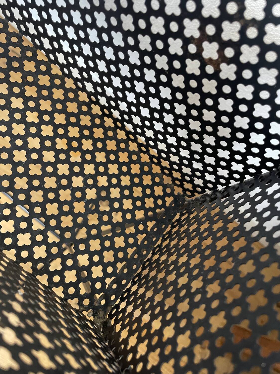 1950s black perforated metal planter in the style of Mathieu MATEGOT