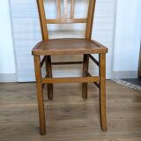Antique patinated wooden bistro chair from the early 20th century.