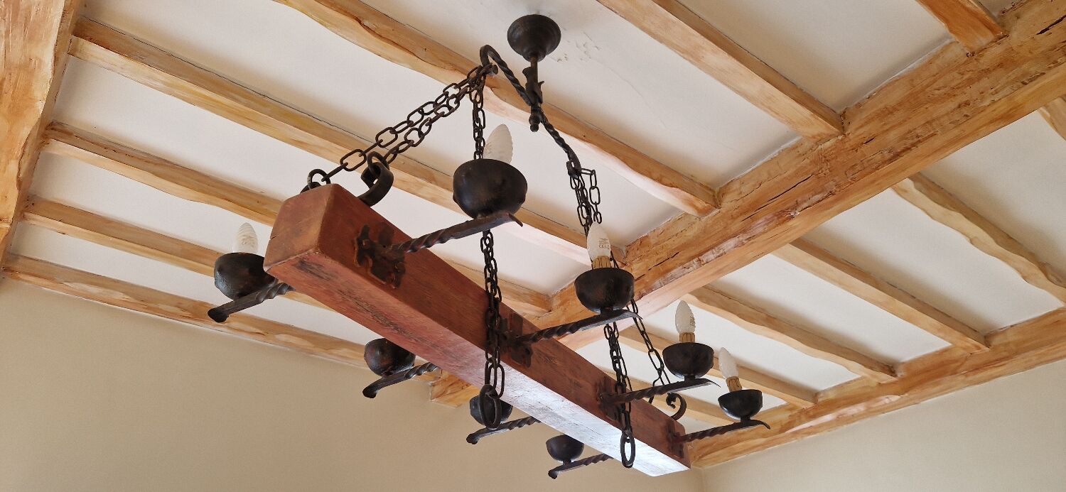 Wood and forged metal chandelier