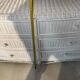 White rattan bedroom set: chest of drawers, mirror, bed, basket