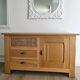 Buffet / TV unit in solid oak with a caned door.