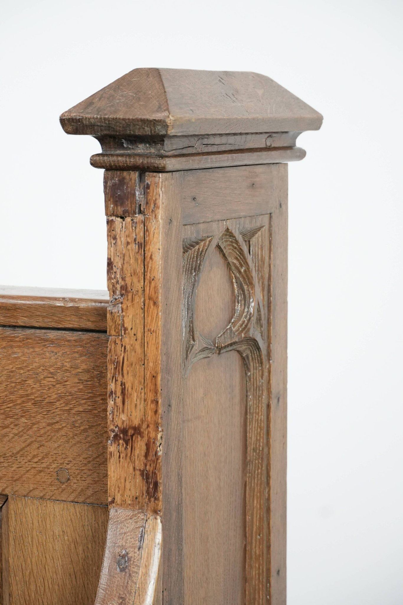 Antique oak church bench in Gothic style with beautiful wood carving