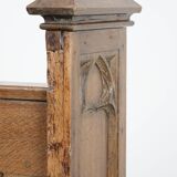 Antique oak church bench in Gothic style with beautiful wood carving