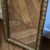Old rectangular mirror between two golden Louis Philippe