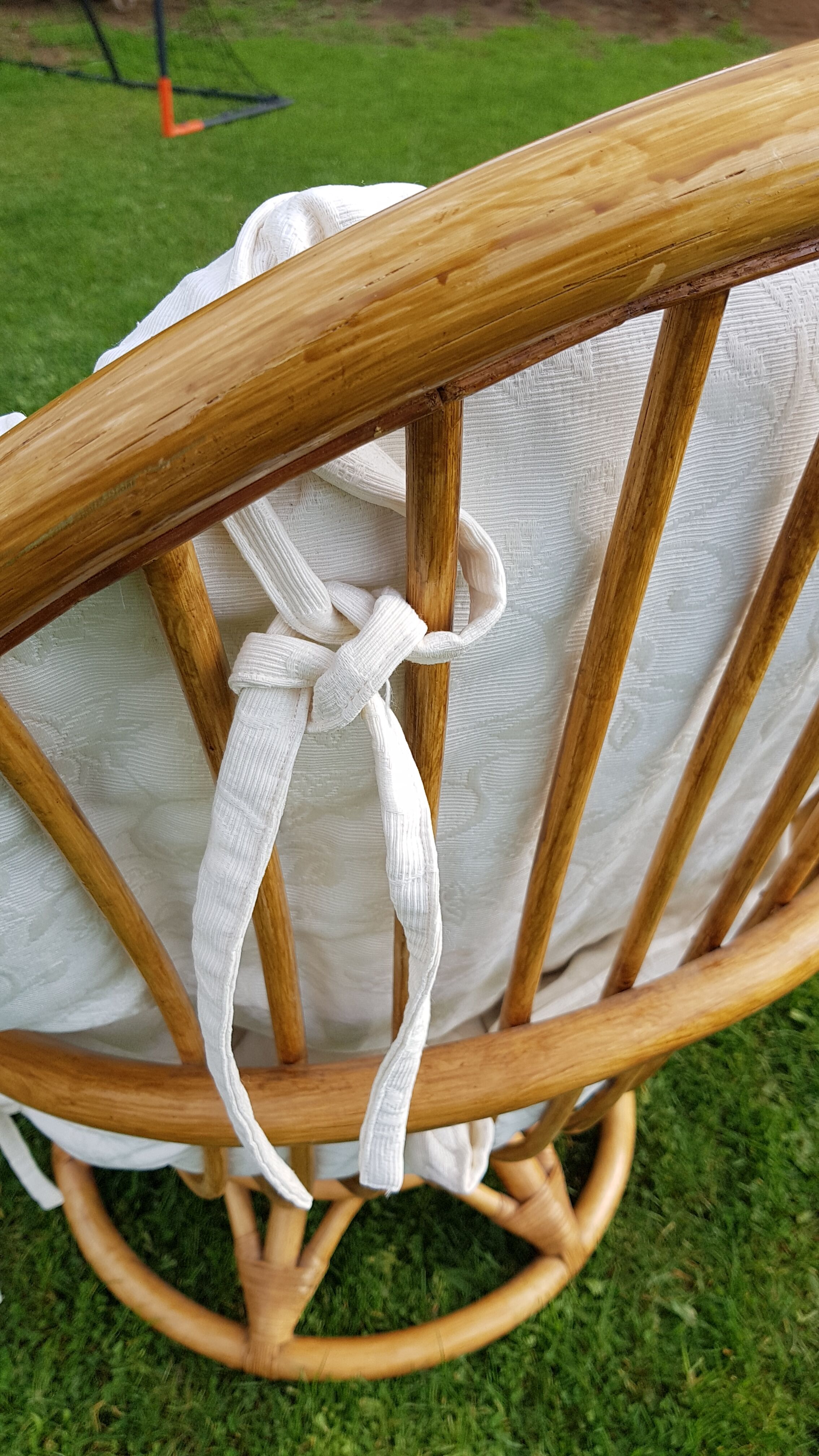 Pair of swivel rattan armchairs