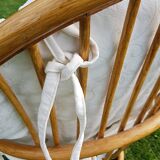 Pair of swivel rattan armchairs