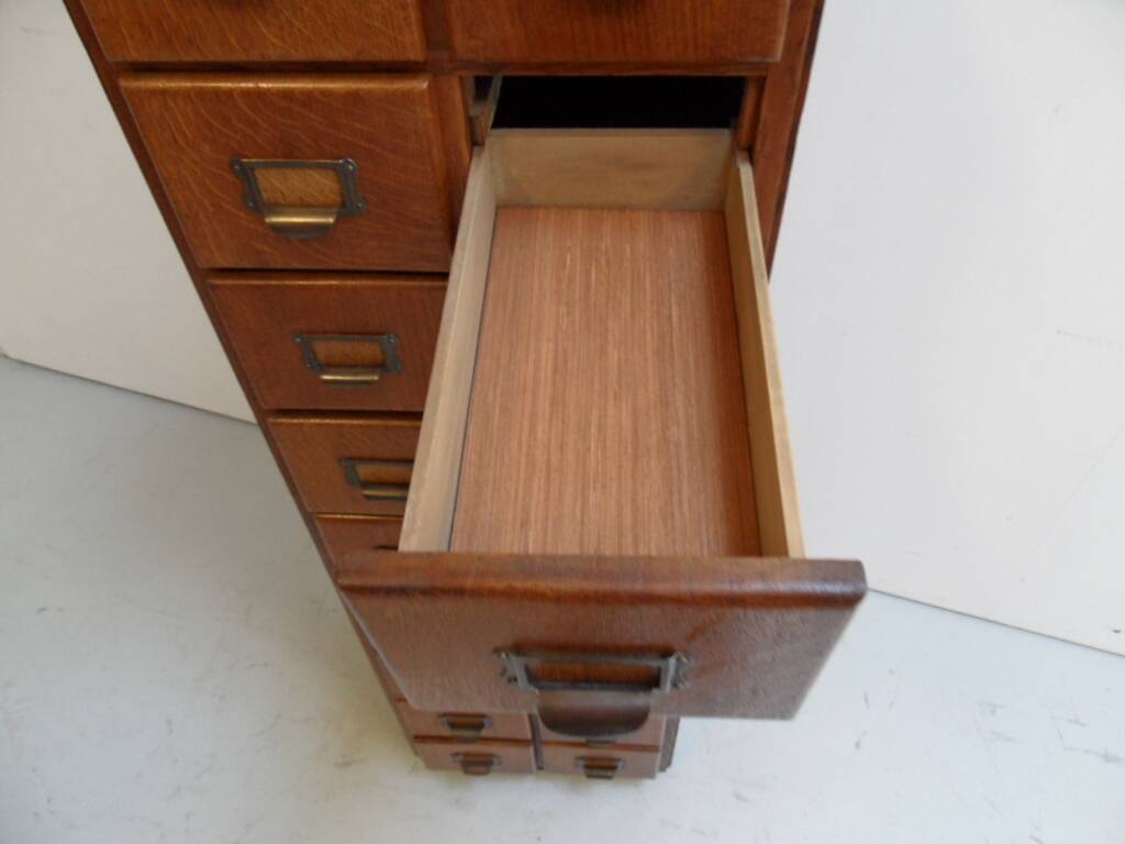 Antique oak apothecary cabinet with drawers