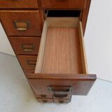 Antique oak apothecary cabinet with drawers
