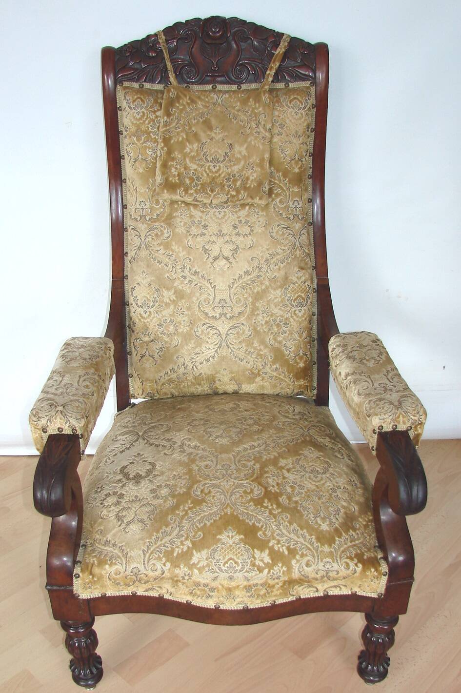 An antique armchair from the turn of the 19th and 20th centuries, carved wa