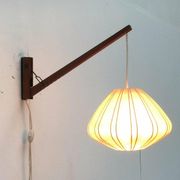 Mid-century pivoting wall lamp with a swing arm, Cocoon, made of teak wood, 1960s.