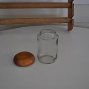 Brown wooden wall spice rack with a set of 6 glass jars, 1950s vintage style.