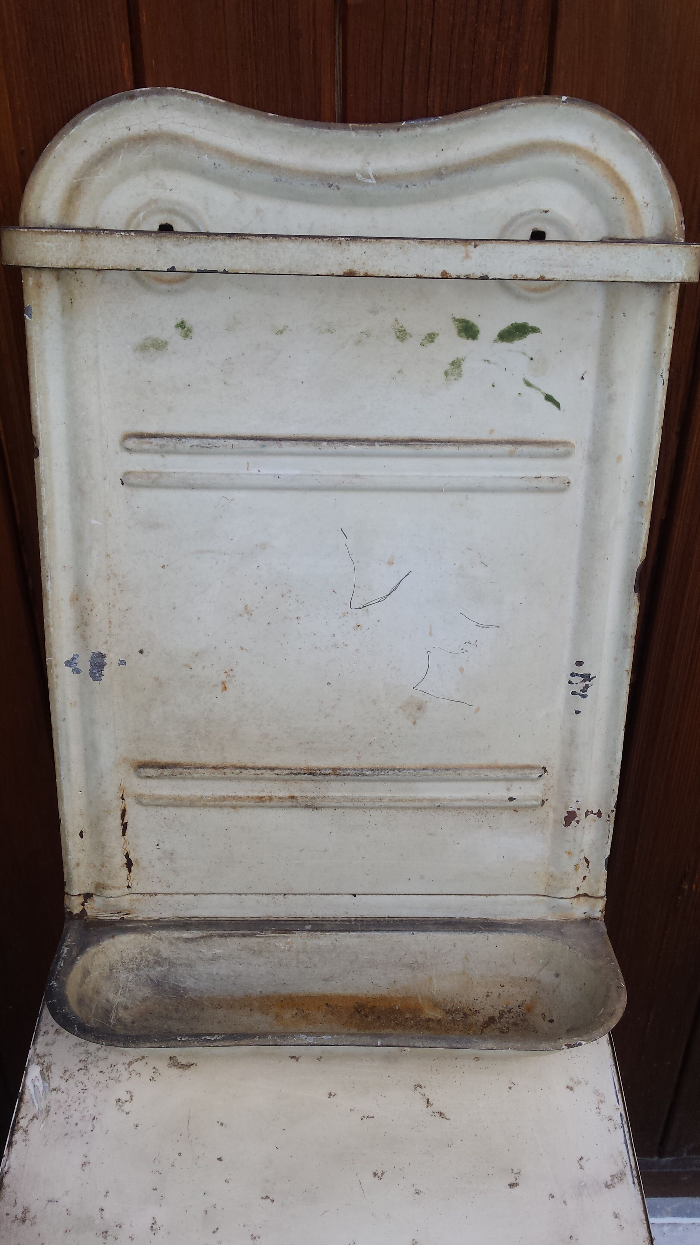 White ladle hangs with bowl