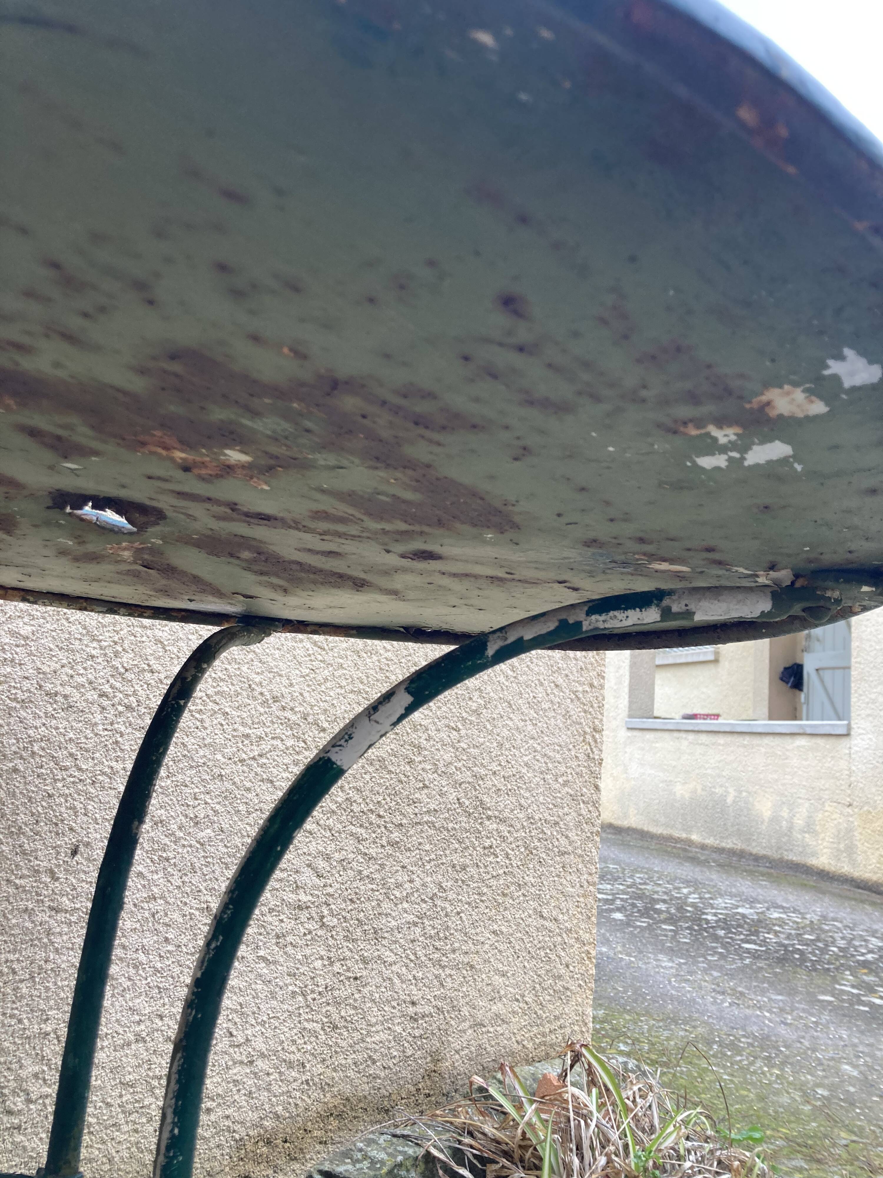 Old wrought iron garden table