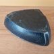 Ceramic ashtray with green and black glaze forming a pipe holder