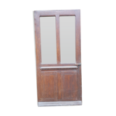 Old-glassed entrance door in tangled oak