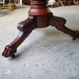 Round pedestal table with marble top and mahogany tripod from the 19th century