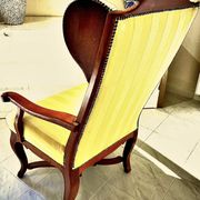 Wingback armchair in walnut in the French Regency style with stretcher in
