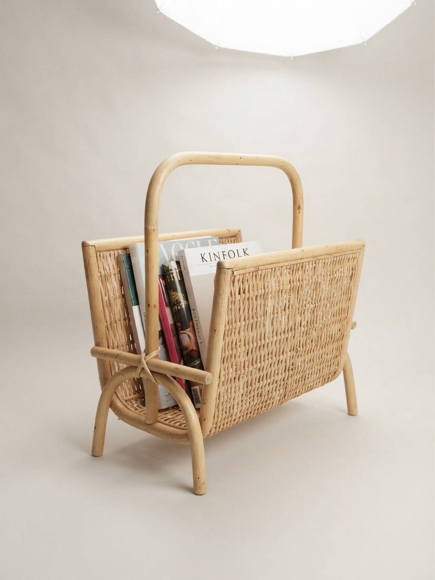 Vintage magazine rack in woven rattan and bamboo.