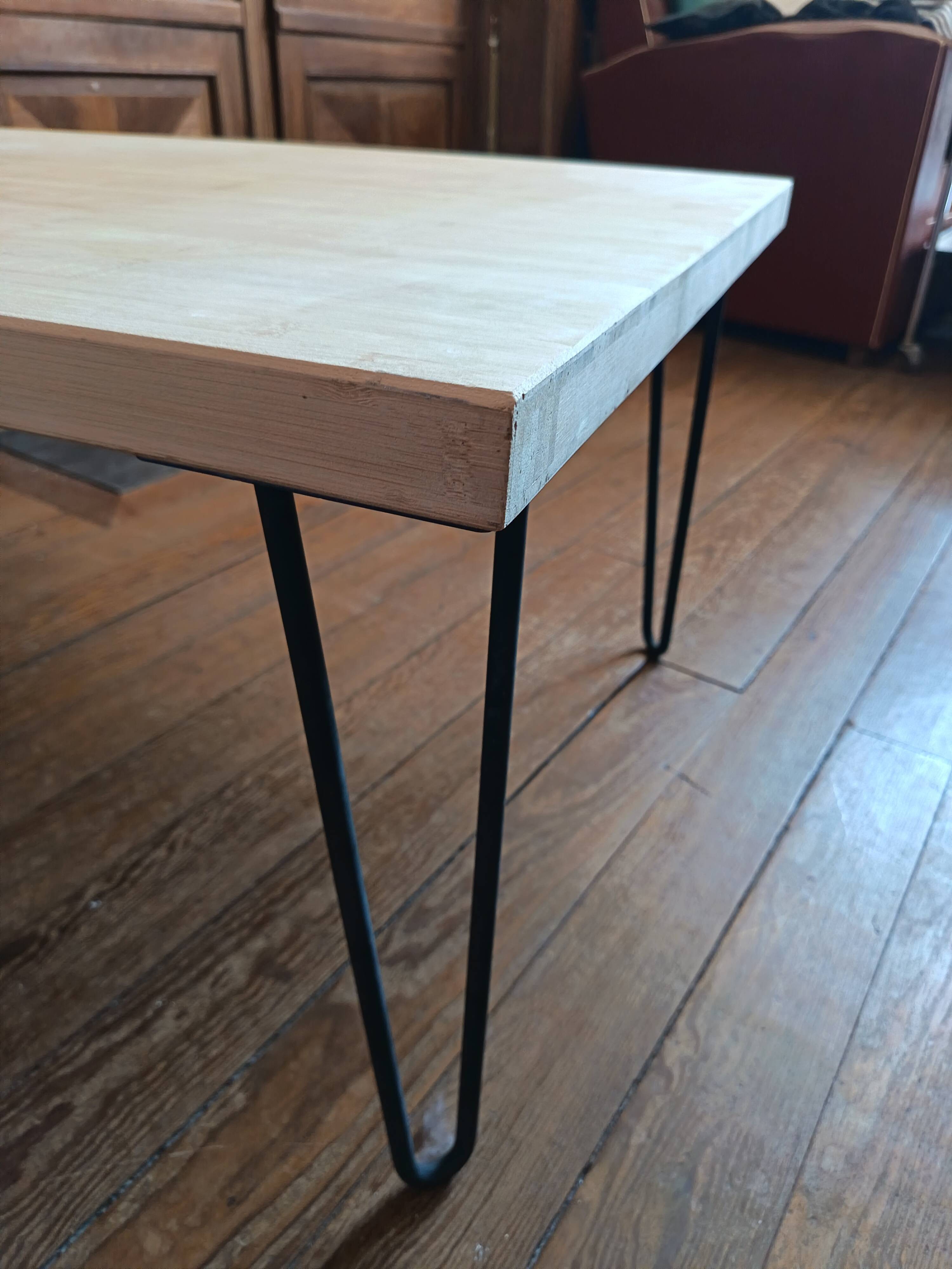 Coffee table in solid bamboo with steel legs.
