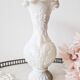 White opaline vase decorated with arabesques and ram's heads