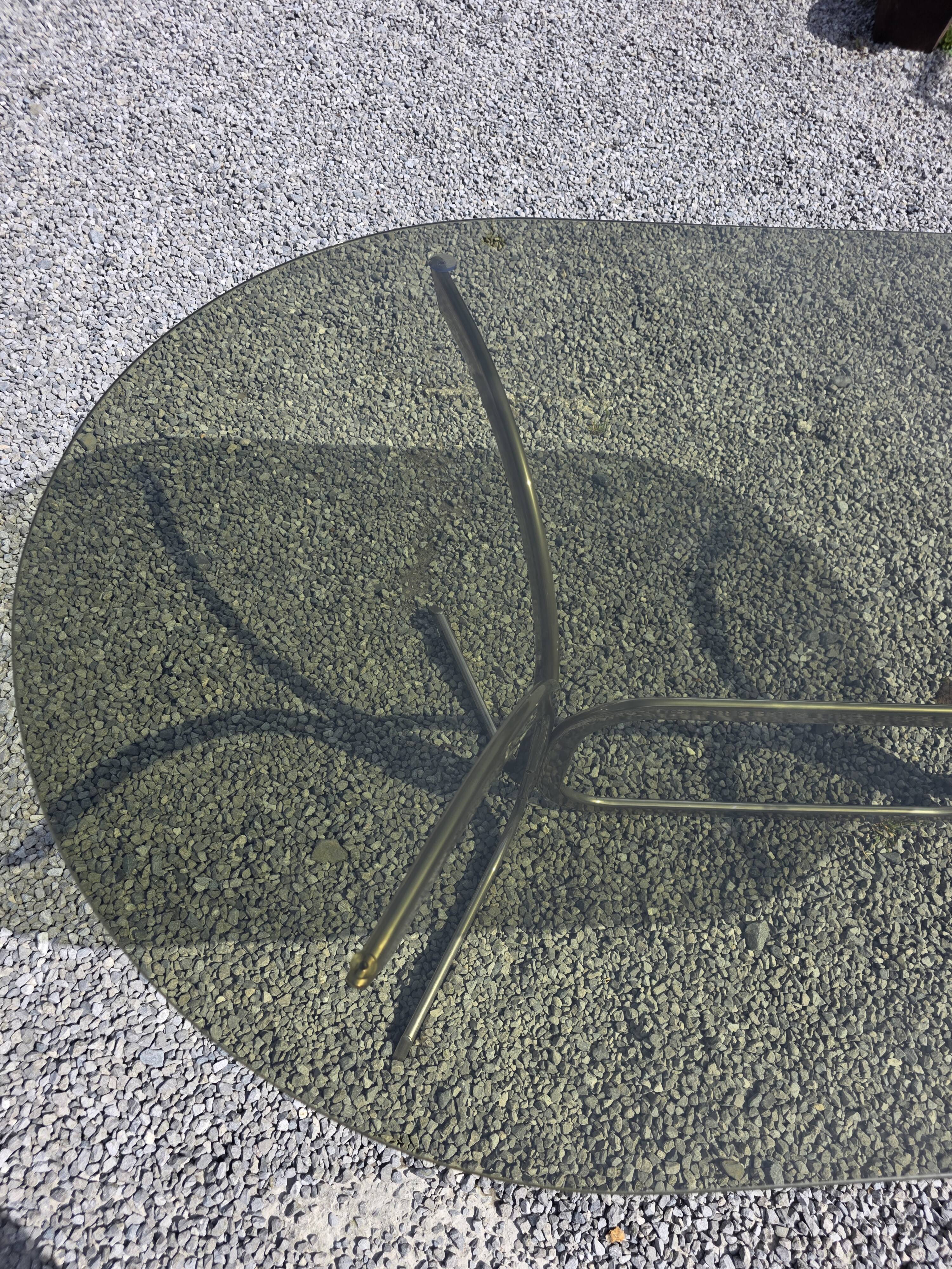 Silver metal table with smoked glass top from the 1970s.