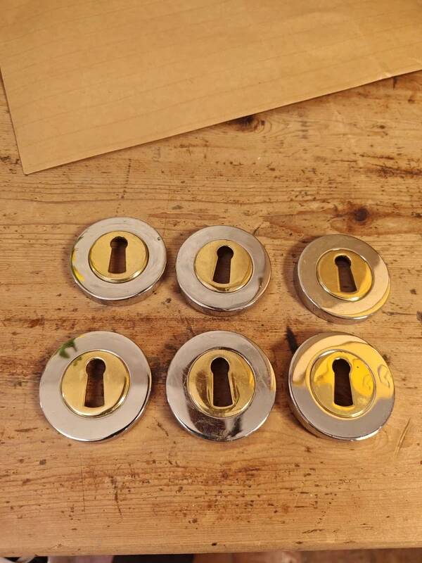 Rare vintage metal door lock fittings in gold and silver.