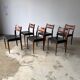Set of 6 Scandinavian design chairs in solid teak and black Skai.