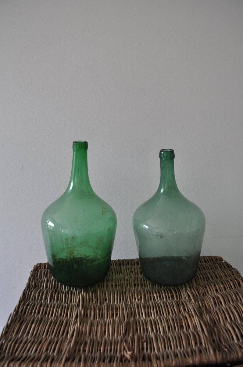 Pair of vintage green glass bottles — Hungarian carboys from the 1960s.