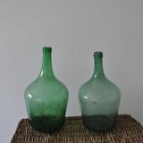 Pair of vintage green glass bottles — Hungarian carboys from the 1960s.