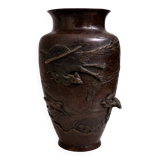 Patinated bronze vase with relief decoration
