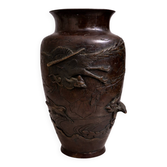 Patinated bronze vase with relief decoration
