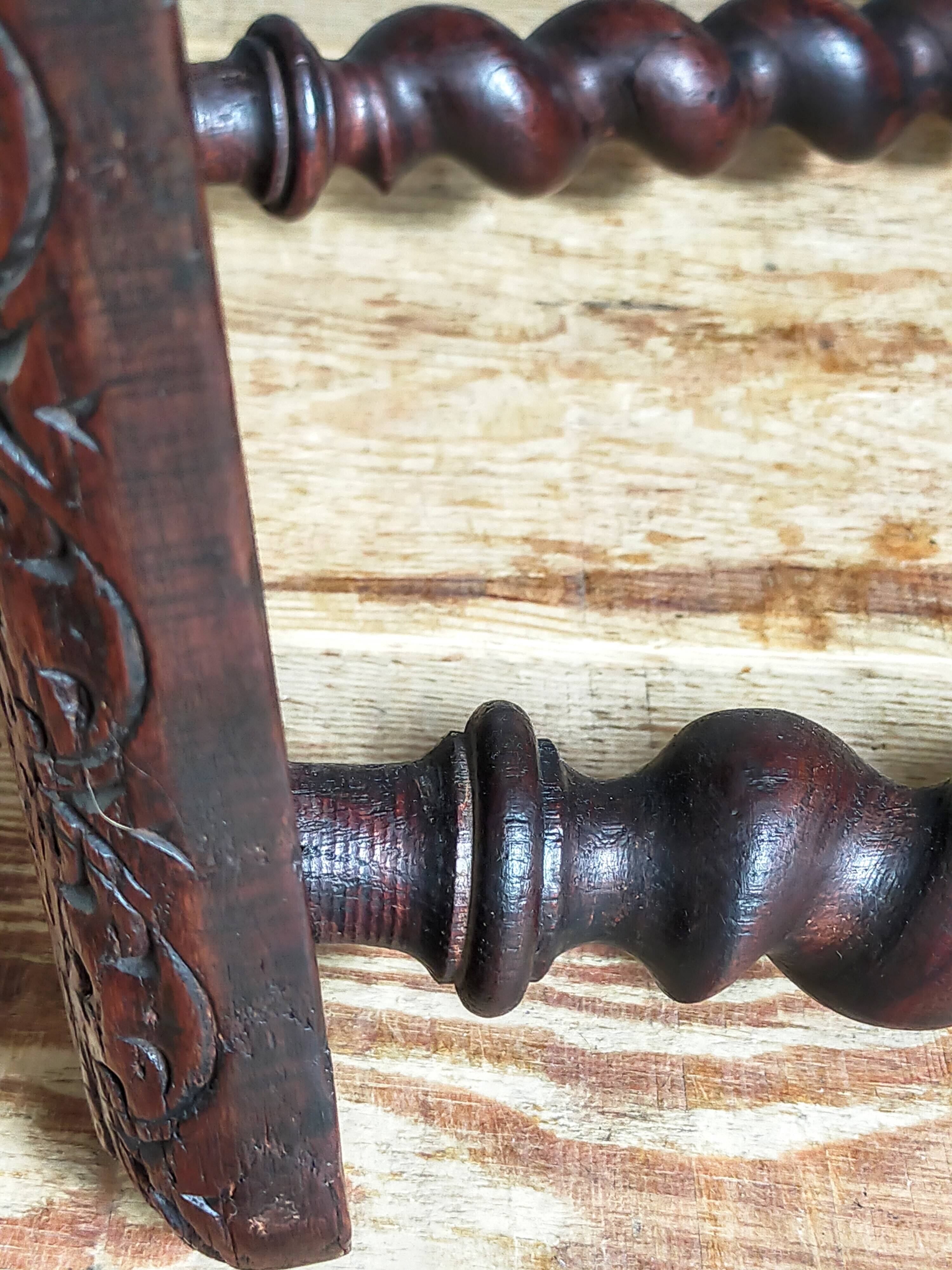 Antique stool in turned and carved solid wood
