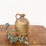 Small antique stoneware jar with handle