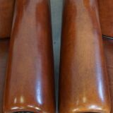 Very beautiful complete set consisting of a sheepskin leather sofa and two armchairs in cognac color