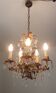 Gold metal chandelier and stamps