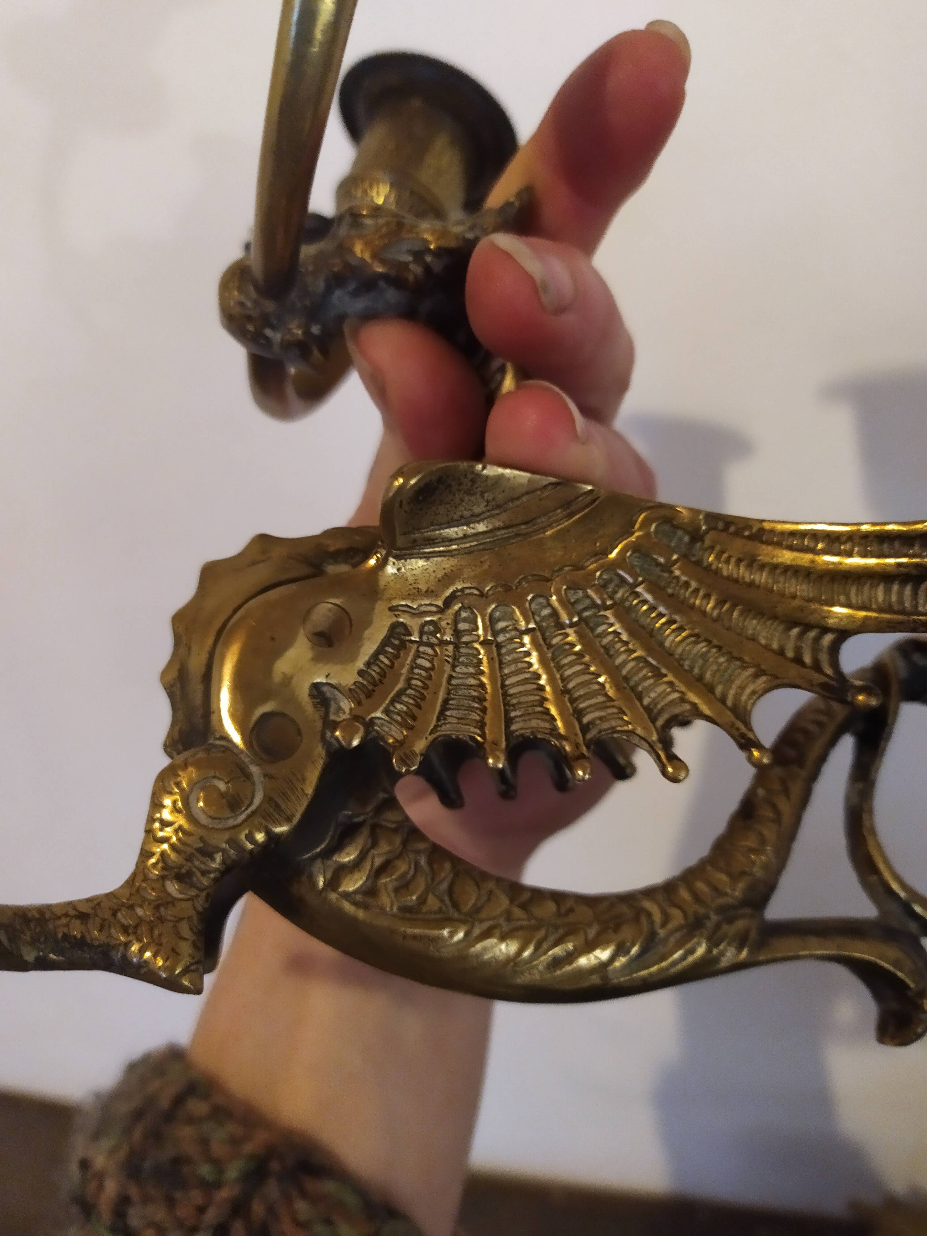 Pair of candlesticks with old chimera dragons hands