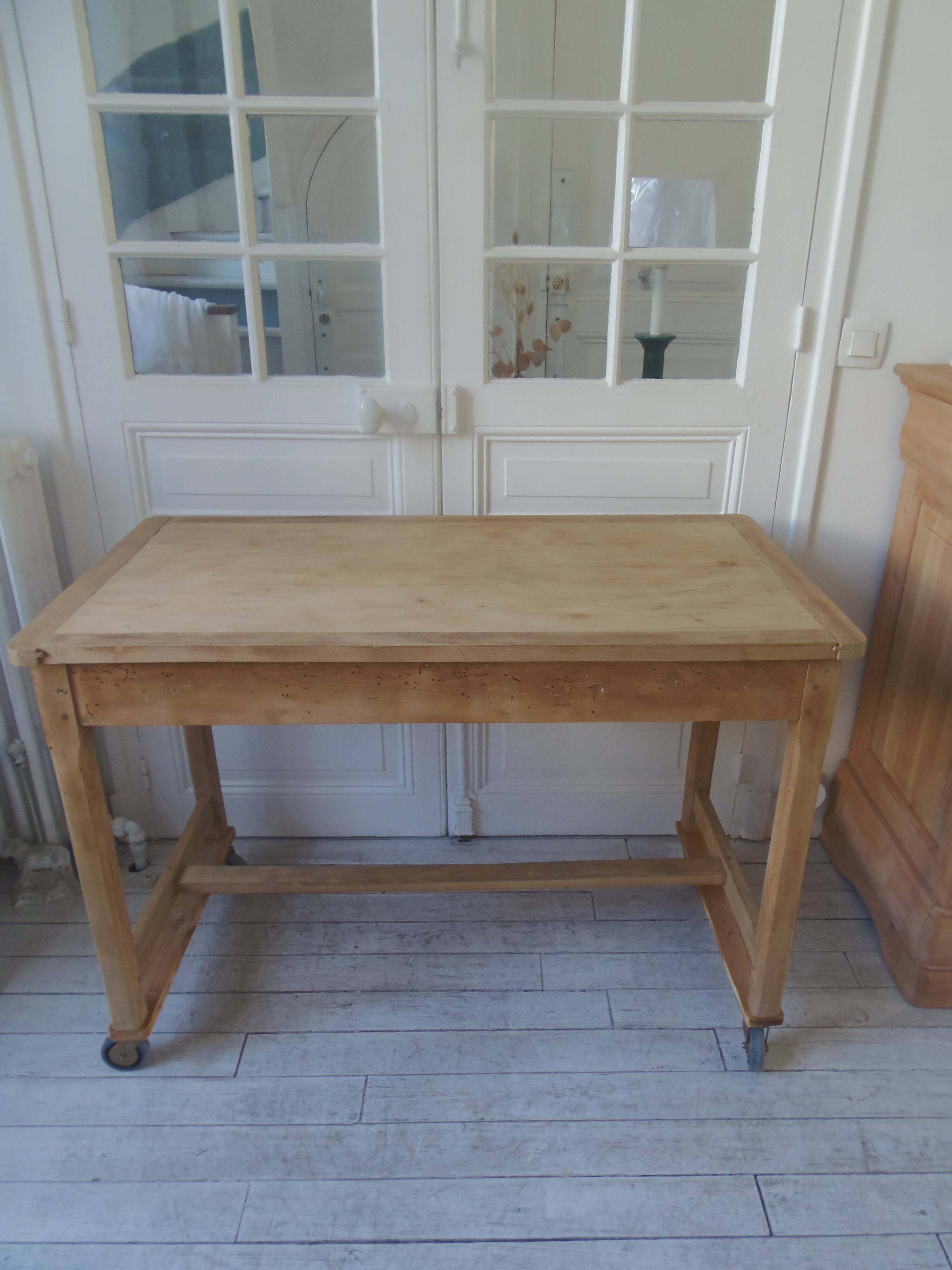 Vintage kitchen table on casters.