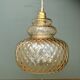 Suspension globe vintage en verre ambré