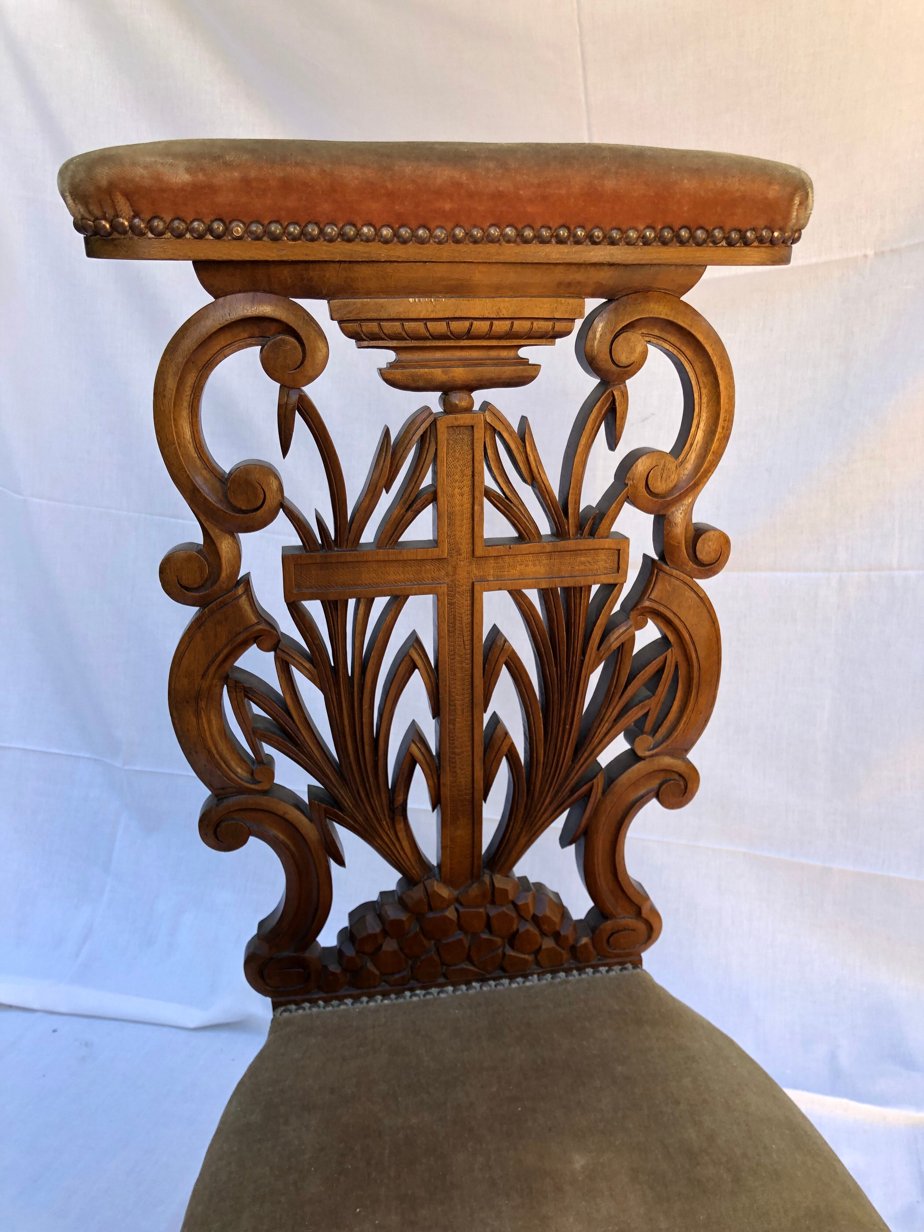 Low armchair in carved wood