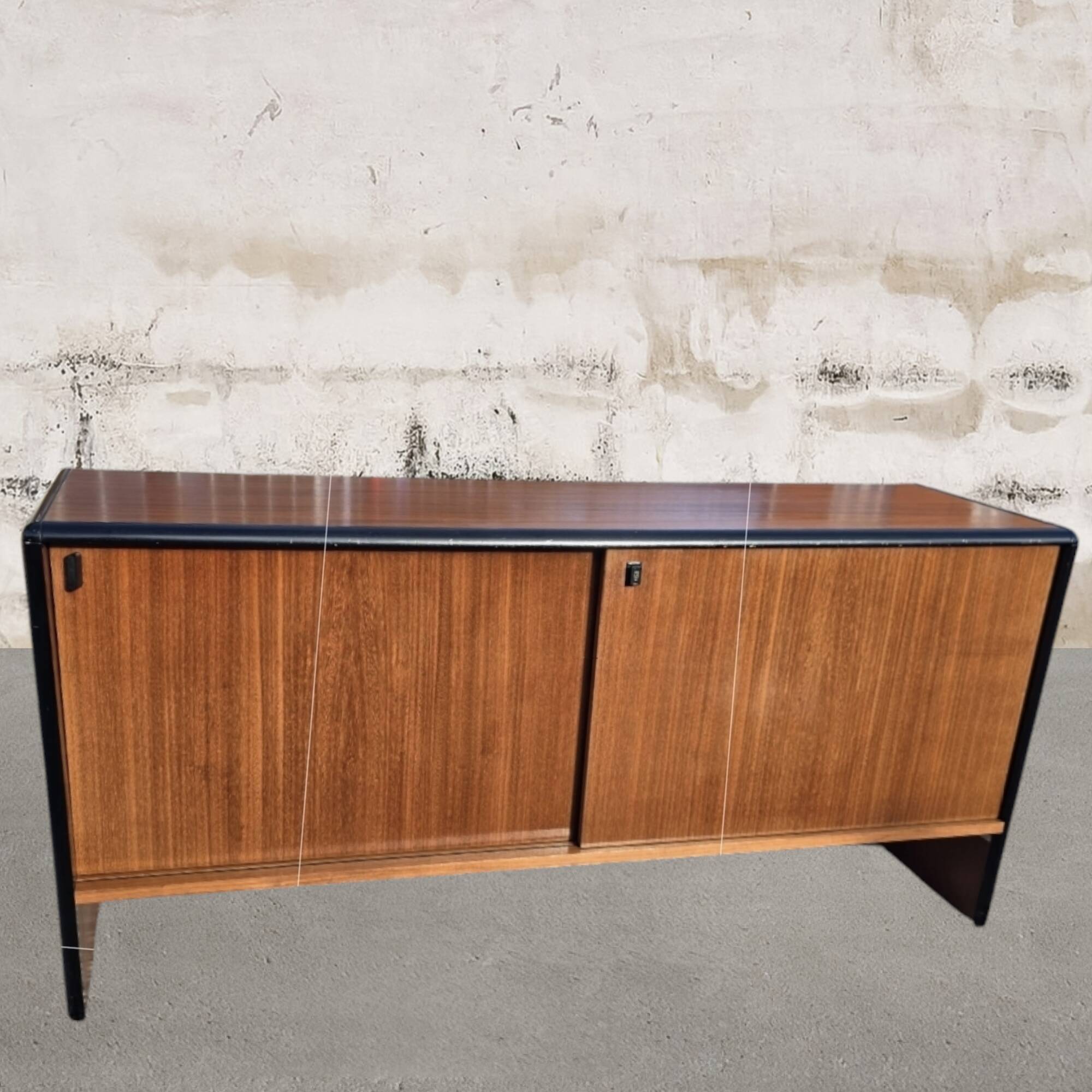 Vintage sideboard with sliding doors from the 60s
