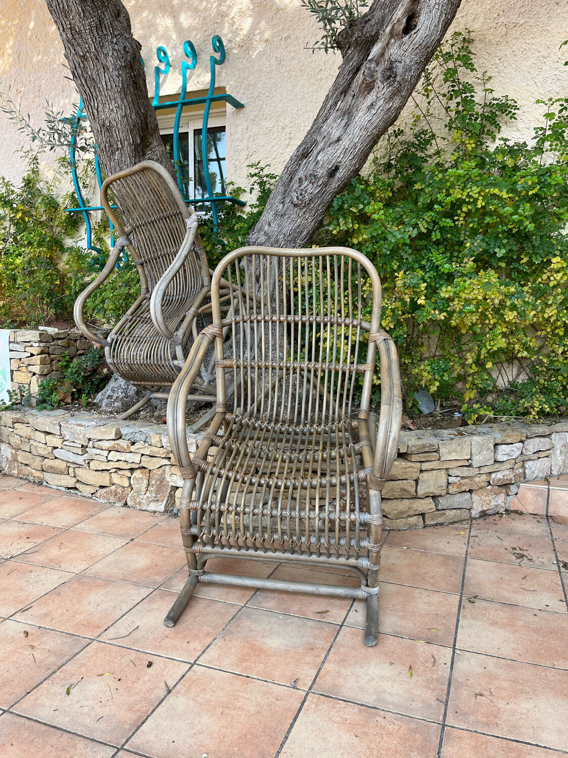 Pair of rocking-chairs in rattan 70s