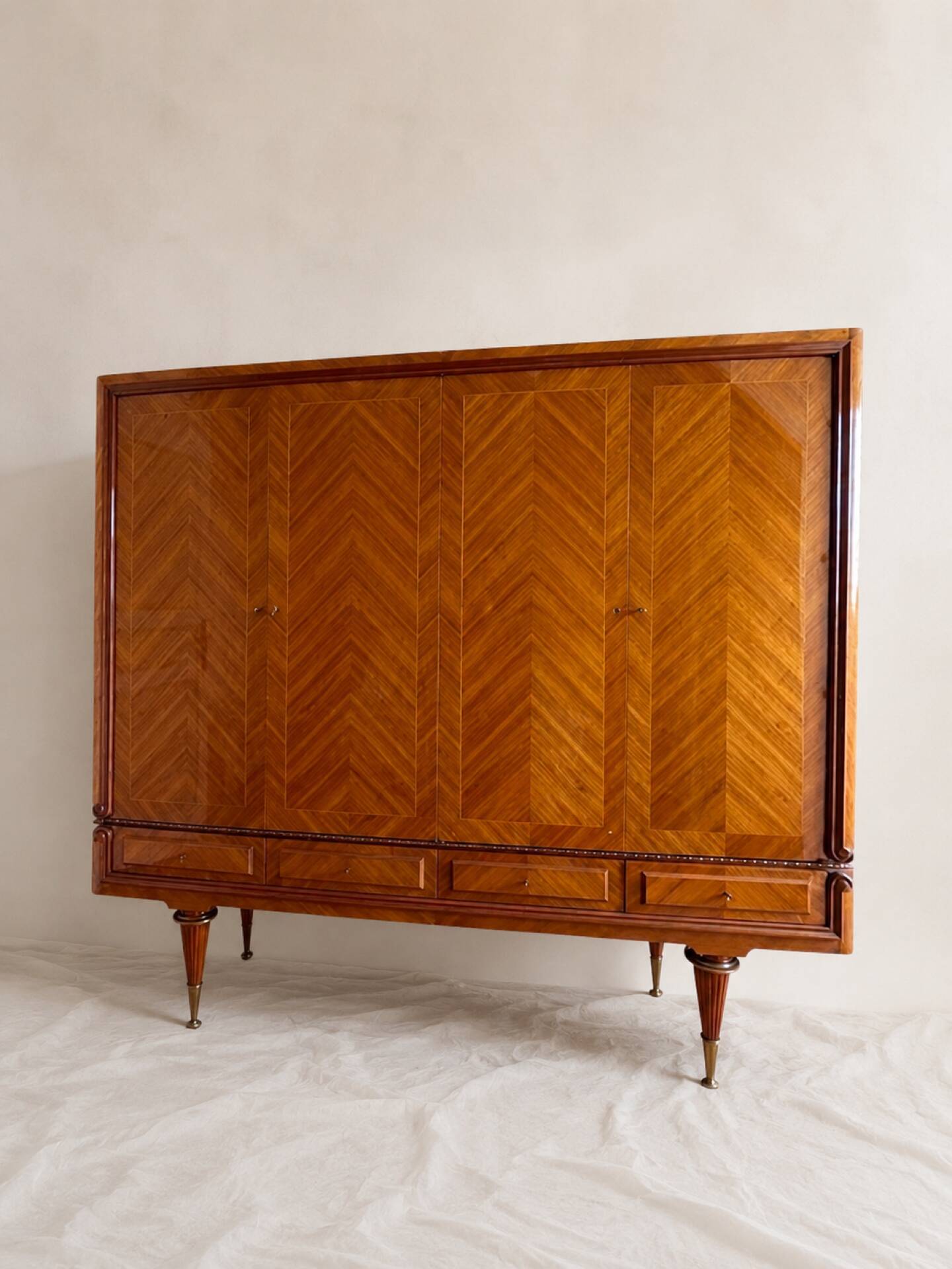 Vintage 4-door chevron wood wardrobe with mirror and gold legs.