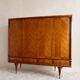Vintage 4-door chevron wood wardrobe with mirror and gold legs.