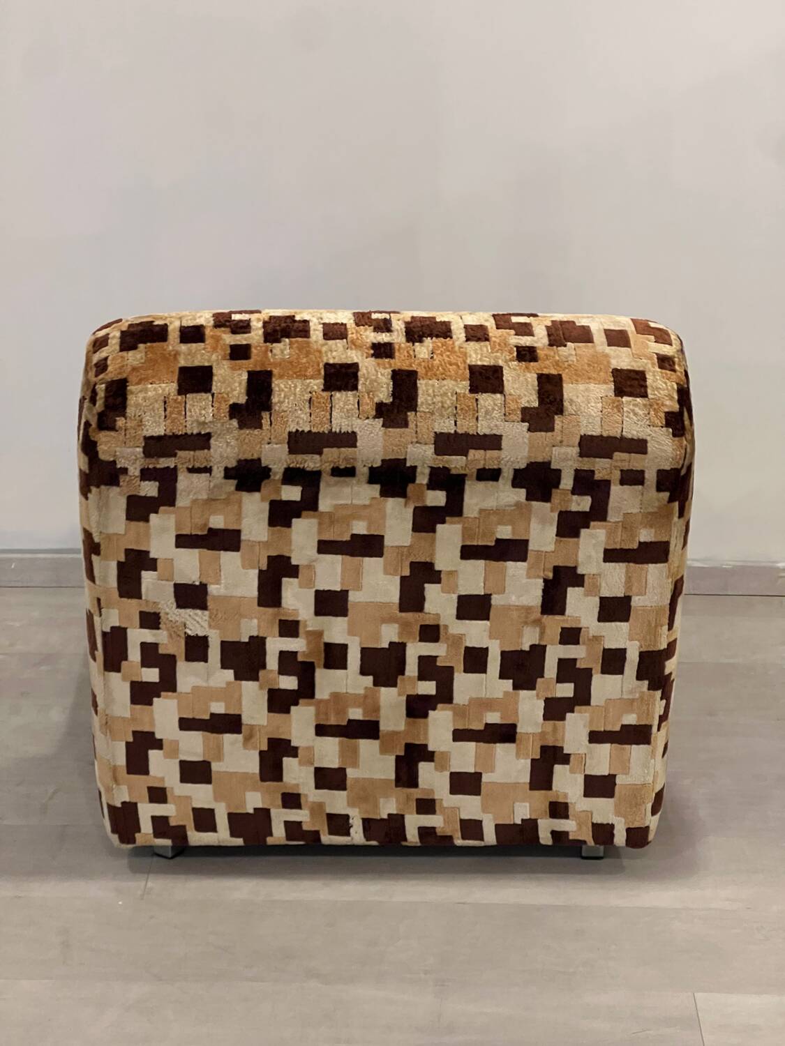 Vintage armchair from the 70s in beige and brown.