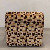 Vintage armchair from the 70s in beige and brown.