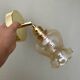 Vintage tulip wall light in amber glass