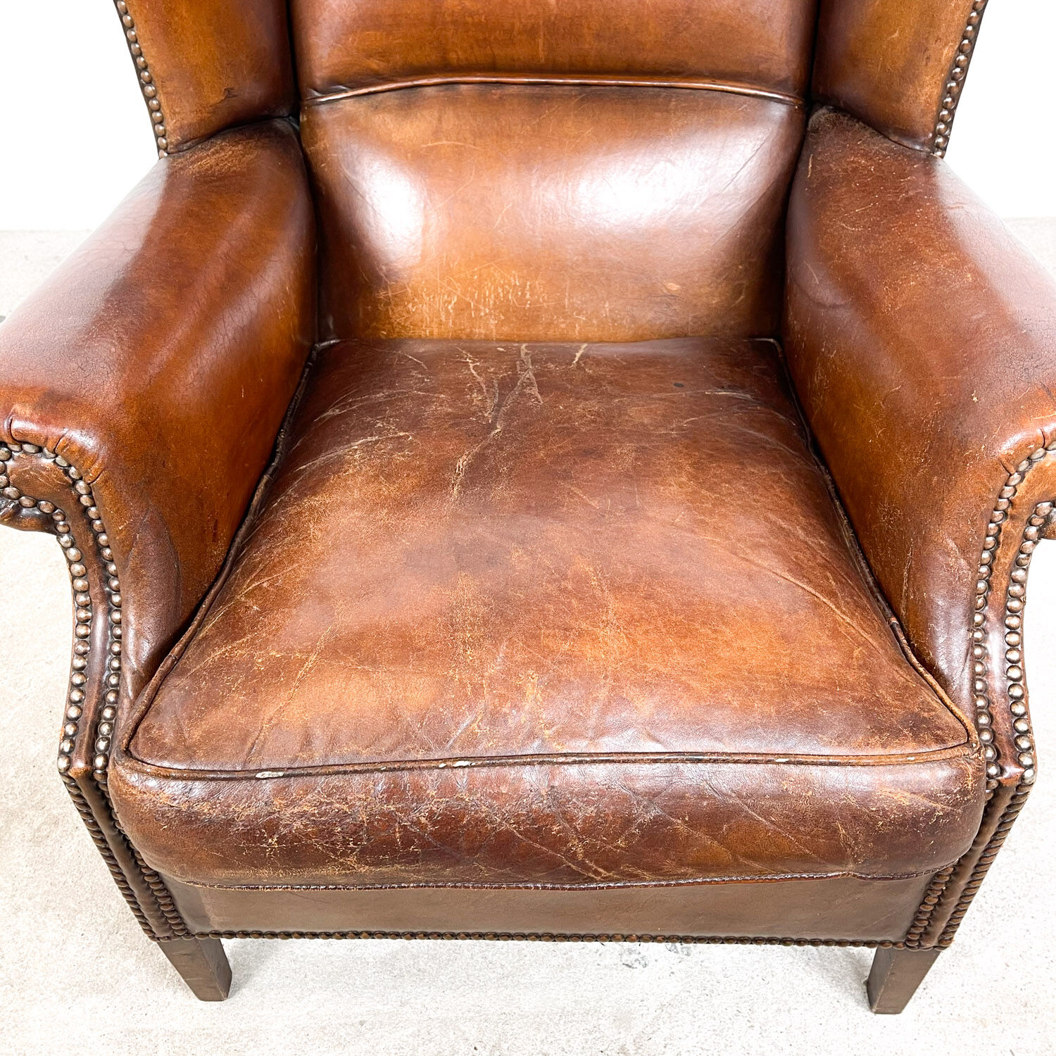 Dark brown sheep leather wingback armchair vintage